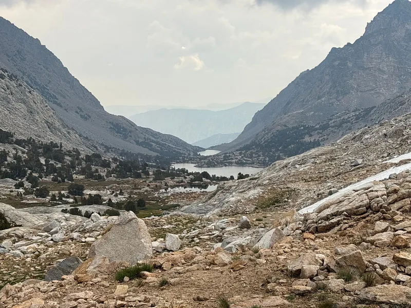 The summit of Paiute Pass, with Paiute Lake and Loch Leven in the distance.