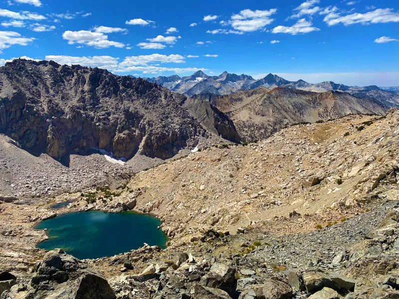 Looking back down towards the western Sierras from the summit. Note the trail to the right of the small lake.
